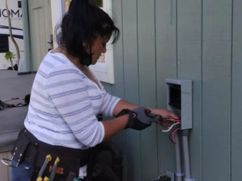 Licensed electrician wiring an exterior subpanel in Valley Center